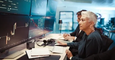 woman-computer-and-screen-for-trading-with-graph